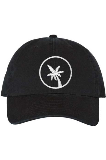 A black baseball cap with a curved brim. The front of the hat features an embroidered seven frond Palm Tree in white thread. The cap has a visible button on the top and an adjustable strap in the back (not visible).