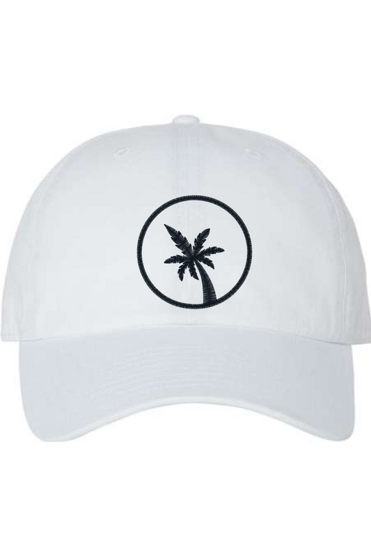 A white baseball cap with a curved brim. The front of the hat features an embroidered seven frond Palm Tree in black thread. The cap has a visible button on the top and an adjustable strap in the back (not visible).
