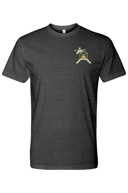 A charcoal short-sleeved t-shirt featuring a small, colorful graphic on the left chest of a small hut with a palm tree on either side.