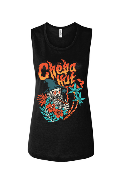 A black women's muscle tank top with a colorful front graphic. The graphic features "Cheba Hut" in a fiery font above an illustration of a skeleton wizard with a long white beard, sunglasses, and a pointed hat. The wizard is smoking a long pipe and is surrounded by tropical plants, including palm trees and red hibiscus flowers.