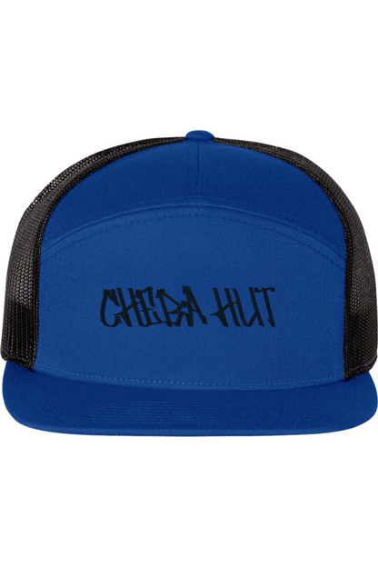 A five-panel trucker hat with a solid blue front panel and brim. The back two panels are black mesh. The front of the hat features the black stylized text 'CHEBA HUT'. The hat has a slightly curved brim and a visible button on the top.