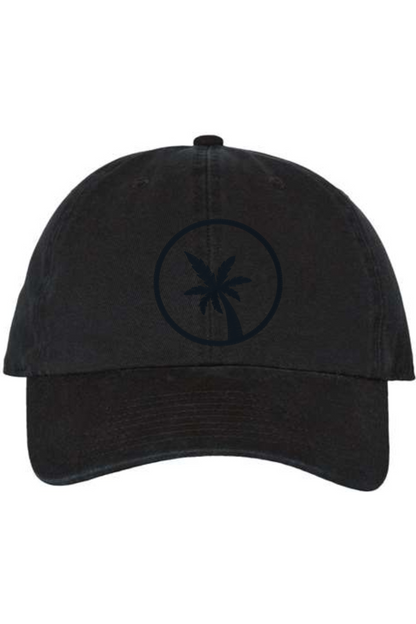 A black baseball cap with a curved brim. The front of the hat features an embroidered seven frond Palm Tree in black thread. The cap has a visible button on the top and an adjustable strap in the back (not visible).