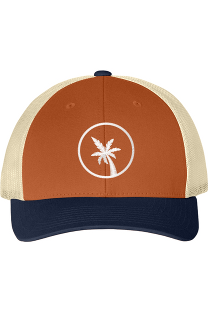 An orange and cream trucker hat with a blue bill and a  palm tree design on a white background