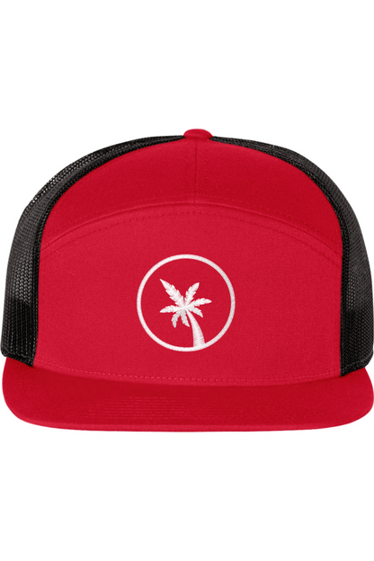 A seven -panel trucker hat with a solid red front panel and brim. The back two panels are black mesh. The front of the hat features a seven frond palm tree in white thread. The hat has a slightly curved brim and a visible button on the top.