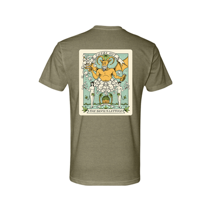 An olive green short-sleeved t-shirt featuring a rectangular, vintage-inspired graphic on the back depicting a horned, winged figure with two smaller figures and the text 'CHEBA HUT' and 'THE DEVIL'S LETTUCE'. The front of the shirt depicts a small hut with palm trees on each side. 